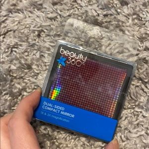 Two sided compact mirror